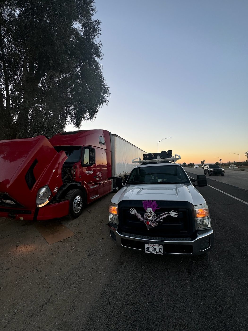 FreightFix roadside repair service with a red semi truck