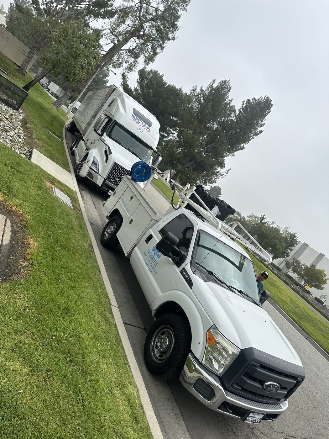 FreightFix mobile service truck working near a semi truck