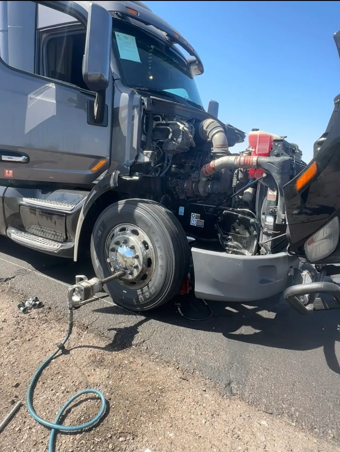 FreightFix diesel troubleshooting and diagnosis on a semi truck with the hood open